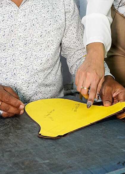 Skilled artisans ensuring stitch precision and pattern accuracy for premium leather bag manufacturing and OEM production in India