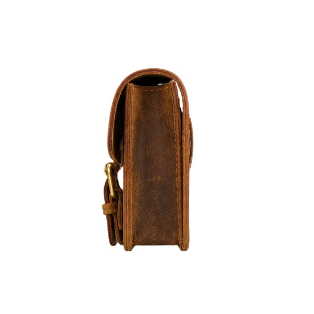 Angled front view of a handcrafted vintage leather small crossbody bag with flap closure.