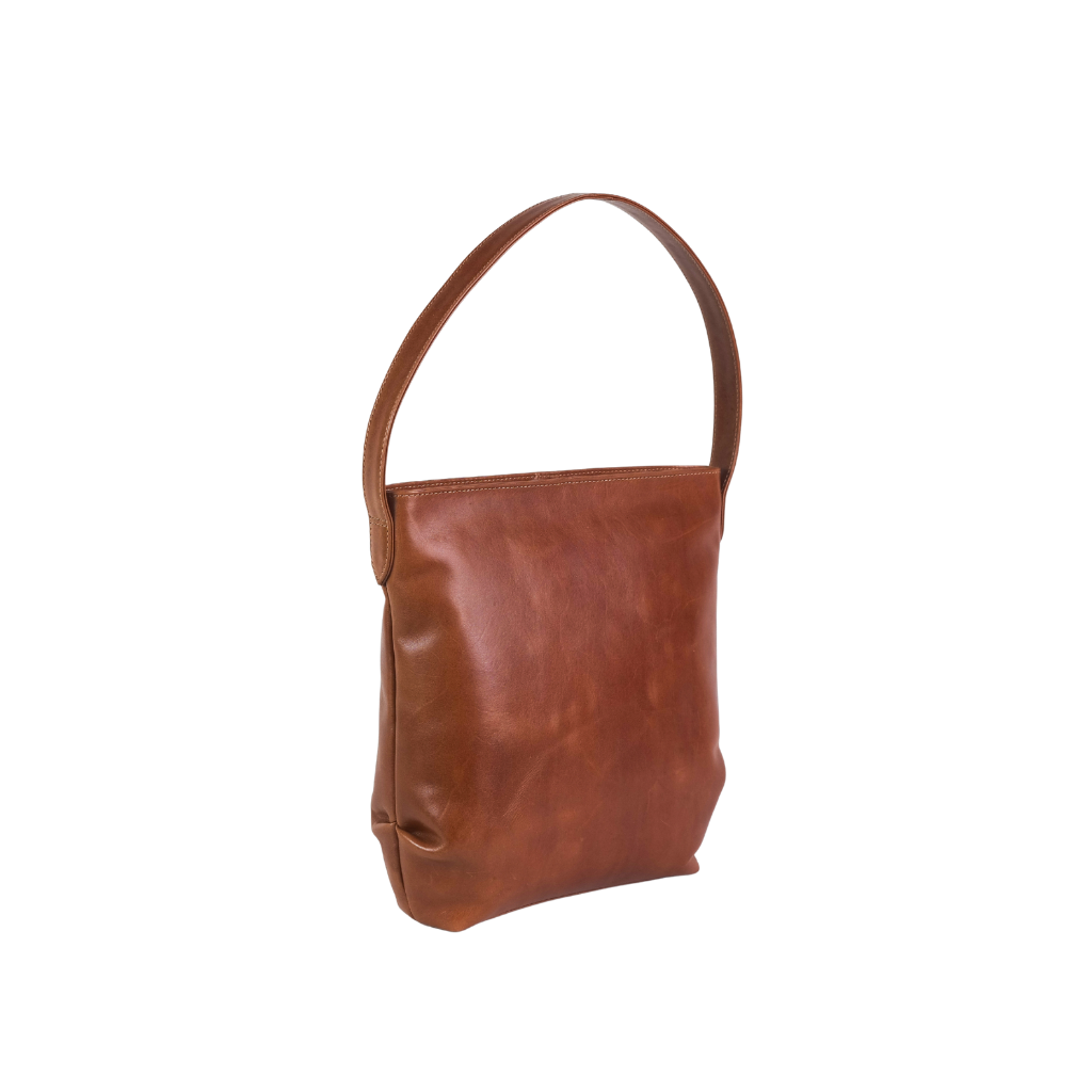 Side profile of premium leather bucket bag with durable craftsmanship.