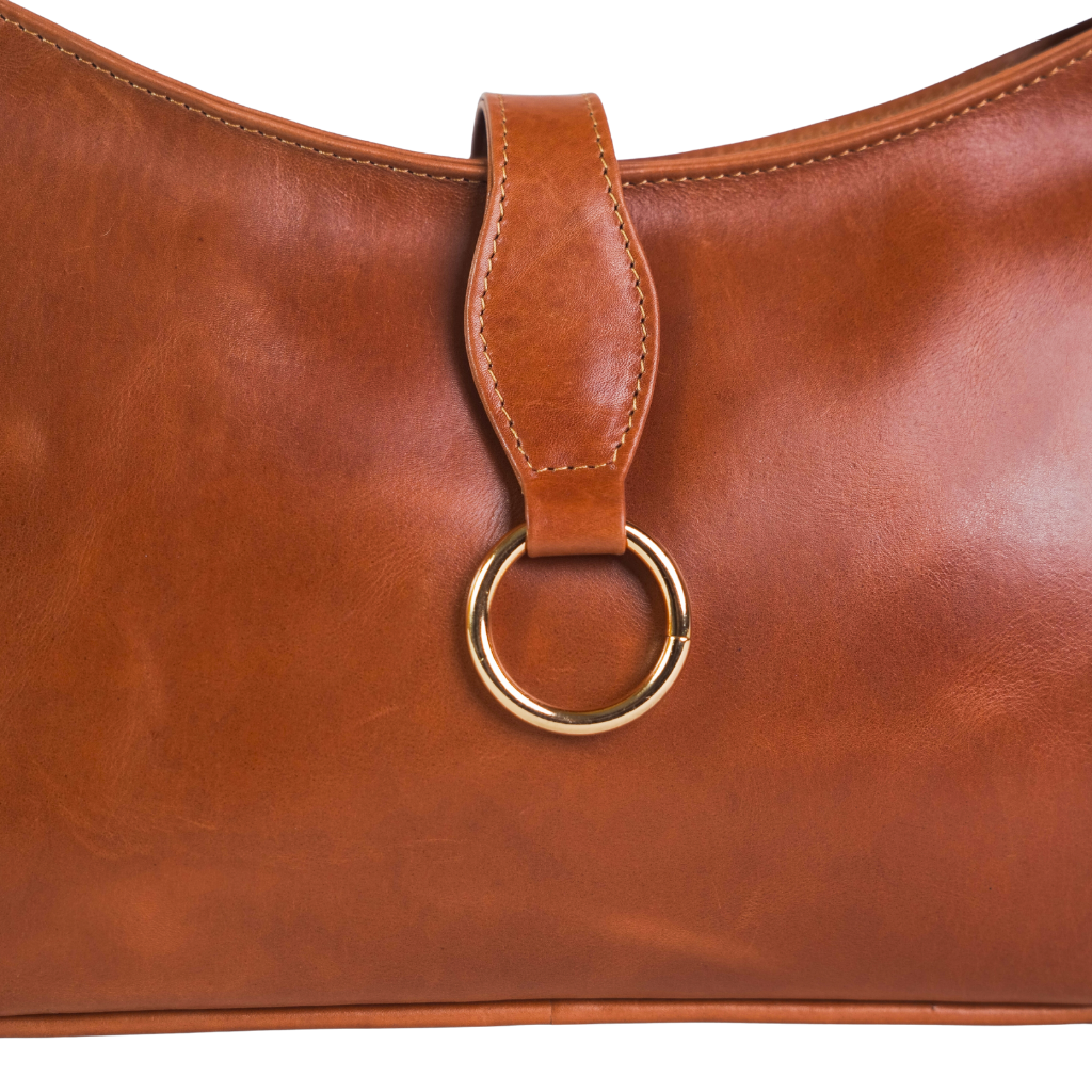 Close-up of premium hardware on leather baguette bag